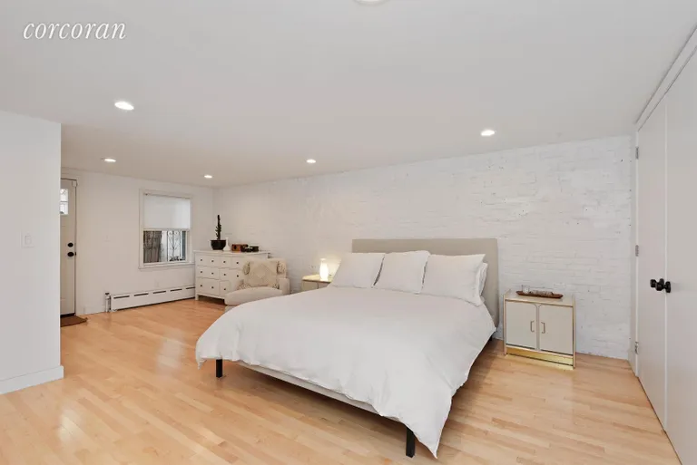 New York City Real Estate | View 207 Evergreen Avenue | Master Bedroom with En Suite Bath & Garden Access  | View 5