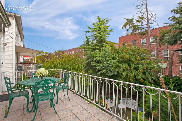 New York City Real Estate | View 30 Paerdegat 1st Street | Terrace off the kitchen overlooking garden | View 6