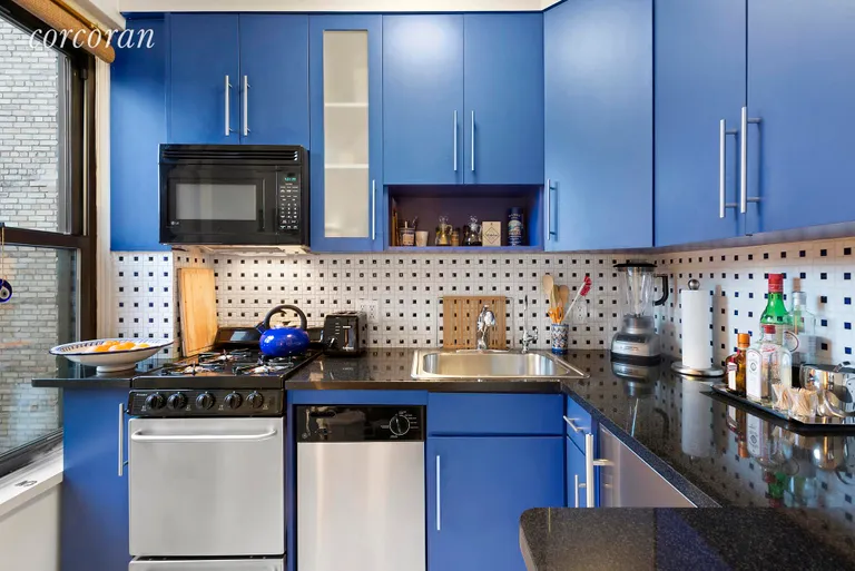 New York City Real Estate | View 319 East 50th Street, 7F | Renovated Kitchen with Window | View 3