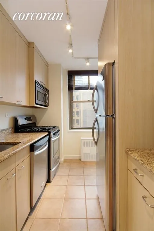 New York City Real Estate | View 301 East 79th Street, 15J | Renovated Kitchen with Stainless Steel Appliances | View 2