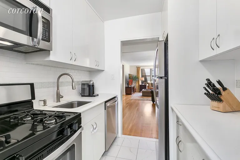 New York City Real Estate | View 30 East 9th Street, 5G | Windowed Galley Kitchen can be opened to LR | View 4