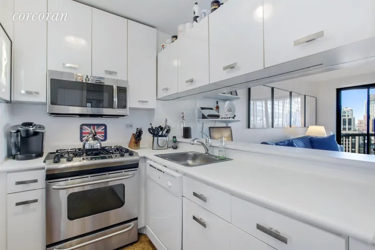 New York City Real Estate | View 45 East 25th Street, 28A | White pass-through kitchen with new appliances! | View 3