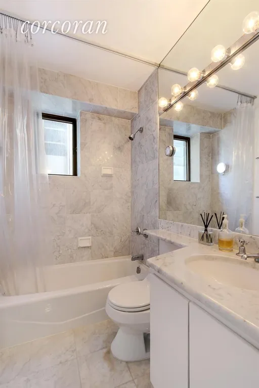 New York City Real Estate | View 45 East 25th Street, 28A | Windowed bath in white Carrara marble! | View 5