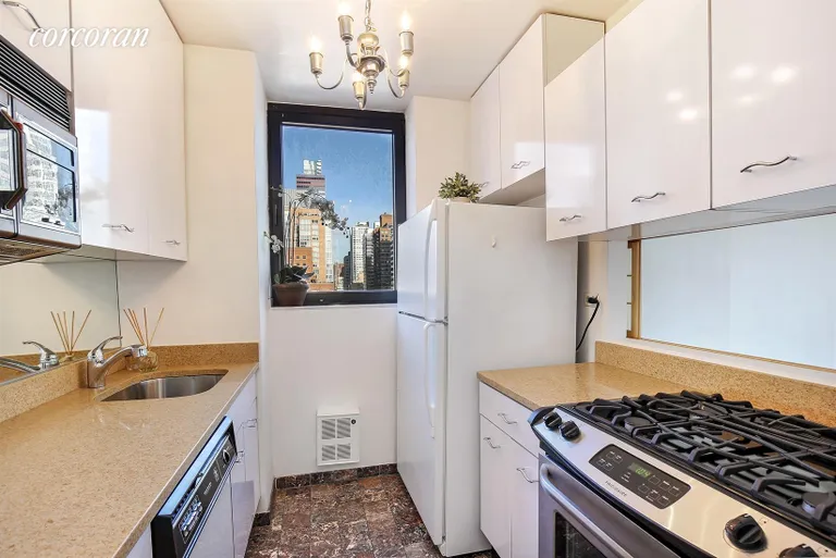New York City Real Estate | View 255 East 49th Street, 23B | Windowed Kitchen | View 5