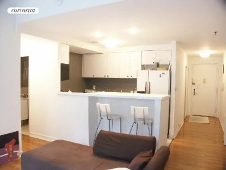 New York City Real Estate | View 140 West 23rd Street, 5D | Open Kitchen with Dining Bar | View 4