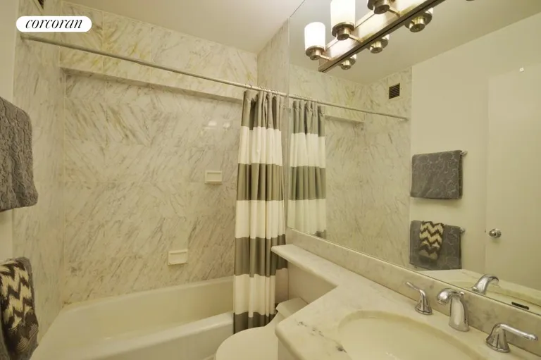 New York City Real Estate | View 45 East 25th Street, 9D | Beautifully restored white marble bath | View 5