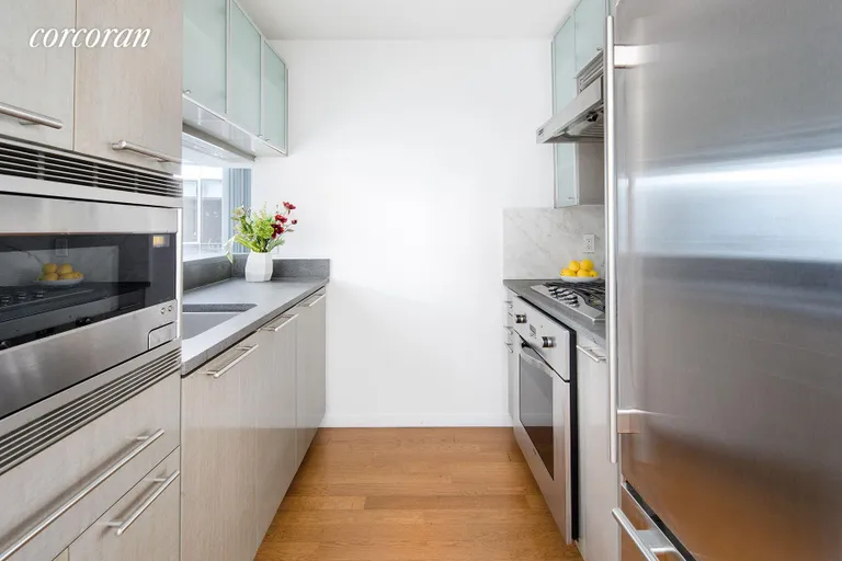 New York City Real Estate | View 200 Chambers Street, 5T | Full-size chef's kitchen with pass through | View 3