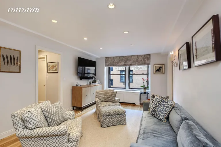 New York City Real Estate | View 205 East 78th Street, 20A | Living room with high ceiling and recessed lights | View 2