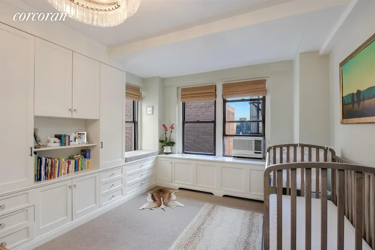 New York City Real Estate | View 205 East 78th Street, 20A | Bedroom with two exposures and built ins | View 5