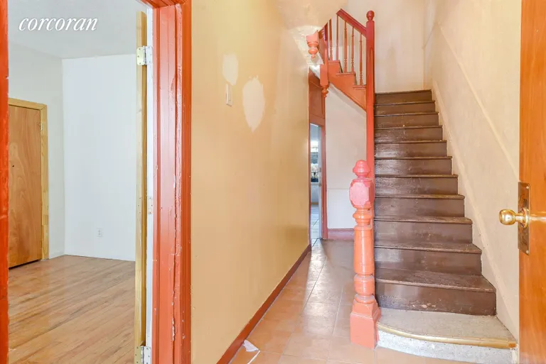 New York City Real Estate | View 1513 Dean Street | Entry Foyer with Solid Original Banister | View 4