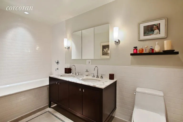 New York City Real Estate | View 201 West 17th Street, 2A | En-suite master bath with soaking tub + shower | View 7