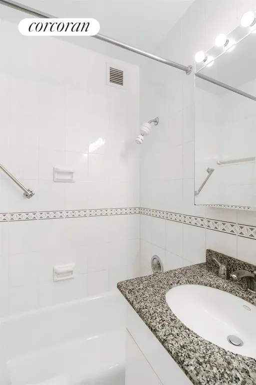 New York City Real Estate | View 400 East 56th Street, 30A | White Tiled Bathroom w/granite counter | View 9