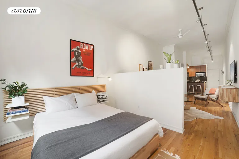 New York City Real Estate | View 23 Waverly Place, 3K | Sleeping area is defined by a low wall | View 3