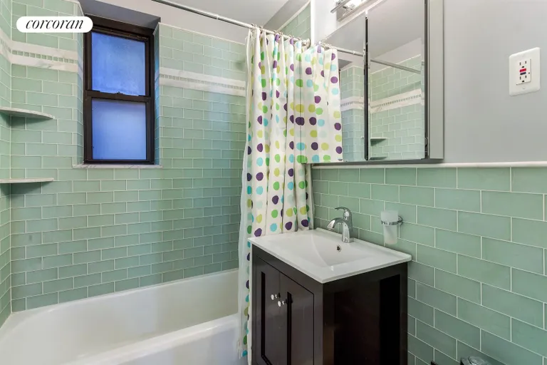 New York City Real Estate | View 415 Ocean Parkway, 1G | Renovated hall bath w/ subway tiles | View 8