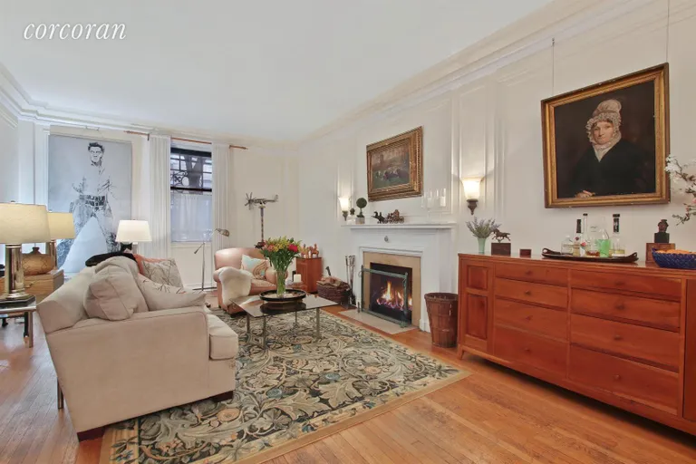 New York City Real Estate | View 205 West 89th Street, 1H | Living Room with Wood Burning Fireplace | View 2