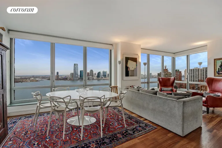 New York City Real Estate | View 30 West Street, 23A | Living Room with Direct Hudson River Views | View 13