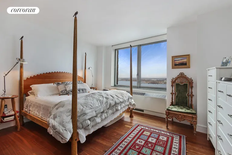 New York City Real Estate | View 30 West Street, 23A | Master Bedroom with Direct River Views | View 15