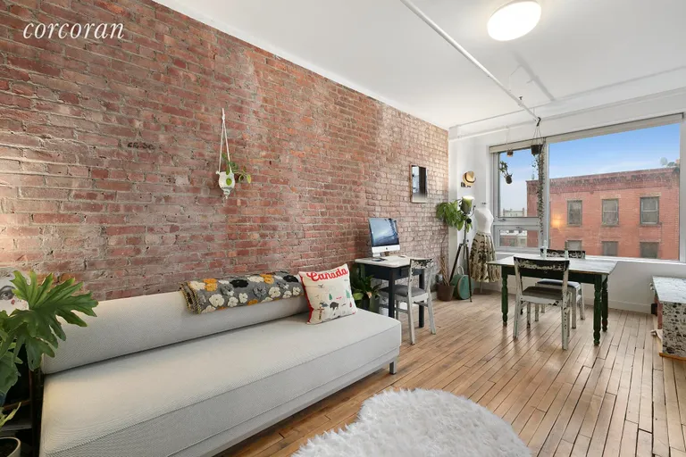 New York City Real Estate | View 95 Lexington Avenue, 4B | Oversized living area with exposed brick | View 4