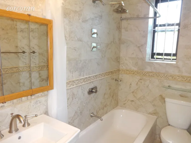 New York City Real Estate | View 756 Brady Avenue, 507 | Beautiful tiled bath & window | View 12