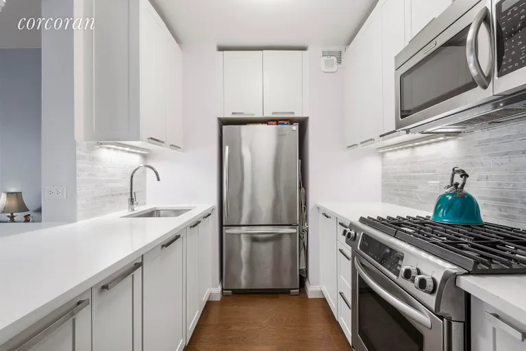New York City Real Estate | View 200 East 94th Street, 519 | Mint Pass-Through Kitchen w Shelf Genie Interiors | View 3