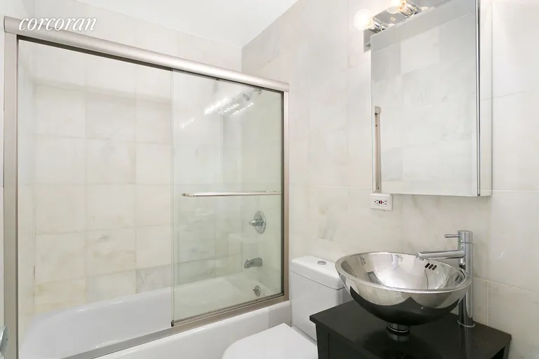 New York City Real Estate | View 77 Bleecker Street, 915W | Renovated bathroom | View 3