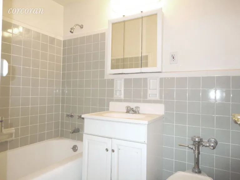 New York City Real Estate | View 175 Willoughby Street, 10E | Tiled Bath with Tub | View 4