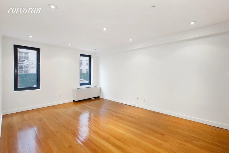 New York City Real Estate | View 215 East 81st Street, 2A | Spacious Living Room With Southern Expsoure | View 7