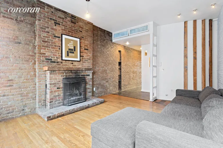 New York City Real Estate | View 325 East 9th Street, 3 | Woodburning Fireplace & exposed brick, oak floors | View 2