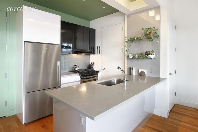 New York City Real Estate | View 315 Gates Avenue, 6R | Stainless steel appliances and cesarstone counters | View 2