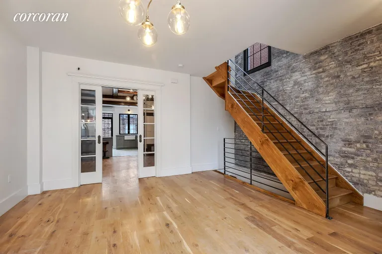 New York City Real Estate | View 3 Martense Court | Living Room w Exposed Brick | View 5