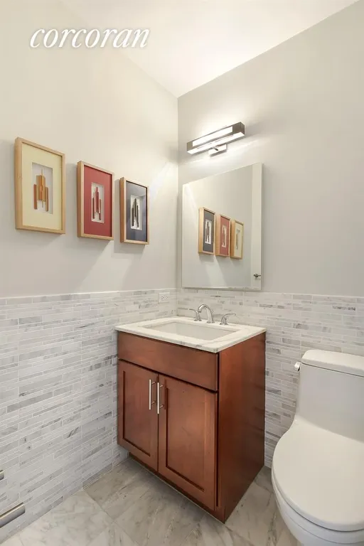 New York City Real Estate | View 1725 York Avenue, 18F | Gorgeous Marble Powder Room | View 9