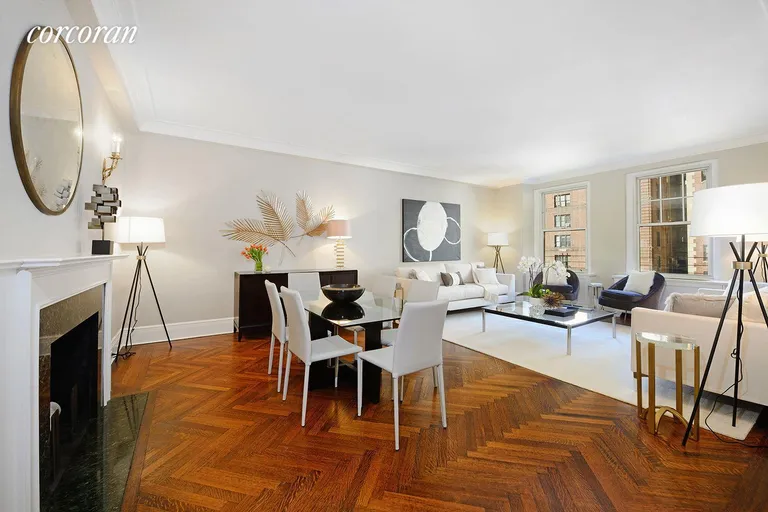 New York City Real Estate | View 1075 Park Avenue, 9C | Oversized Living Room with Wood Burning Fireplace | View 2