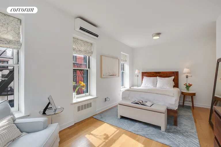 New York City Real Estate | View 183 Columbia Heights, 4 | Master bedroom suite with garden views | View 5