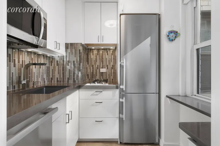 New York City Real Estate | View 115 East 9th Street, 6M | Windowed Kitchen | View 4