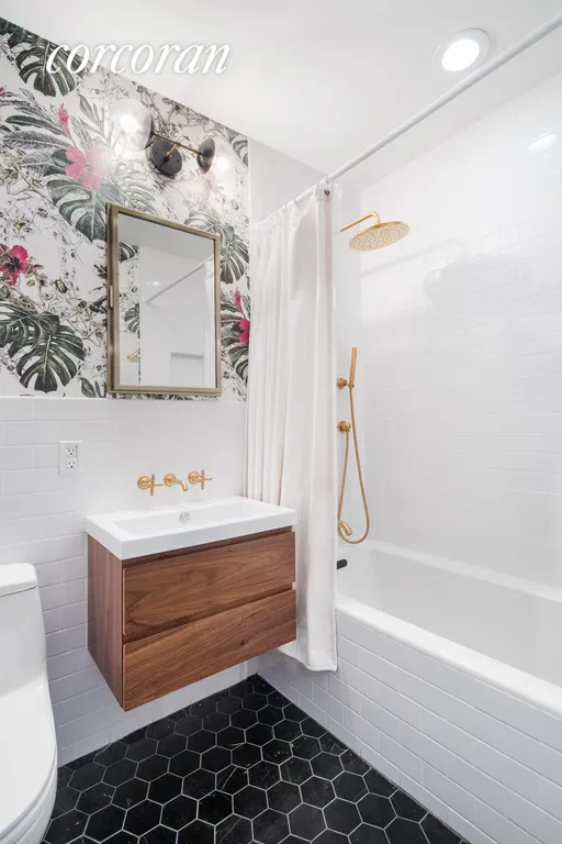 New York City Real Estate | View 23 East 10th Street, 412 | Tastefully renovated 2nd bath with soaking tub | View 8