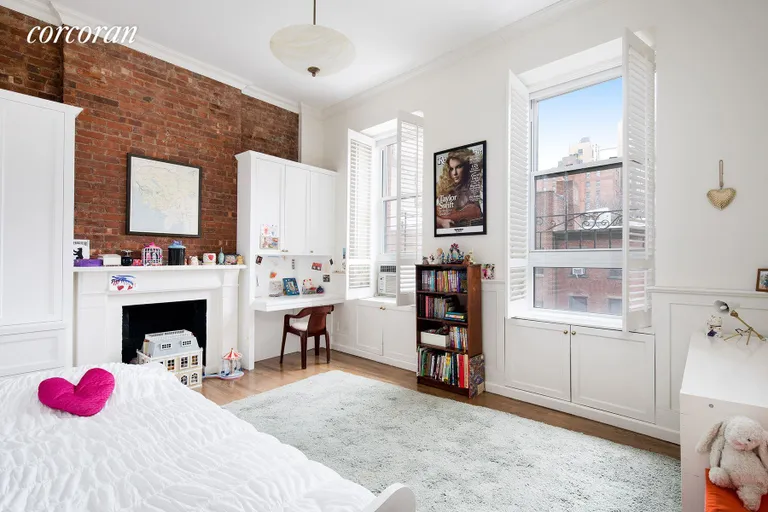New York City Real Estate | View 23 East 10th Street, 412 | Western-facing 2nd bedroom with custom built-ins | View 5