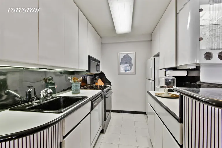 New York City Real Estate | View 211 East 53rd Street, 7C | Large Kitchen with Breakfast Bar | View 2
