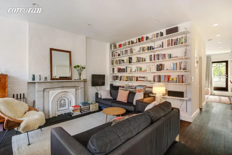 New York City Real Estate | View 363 Henry Street, 3 | Living room with wood burning fireplace | View 2