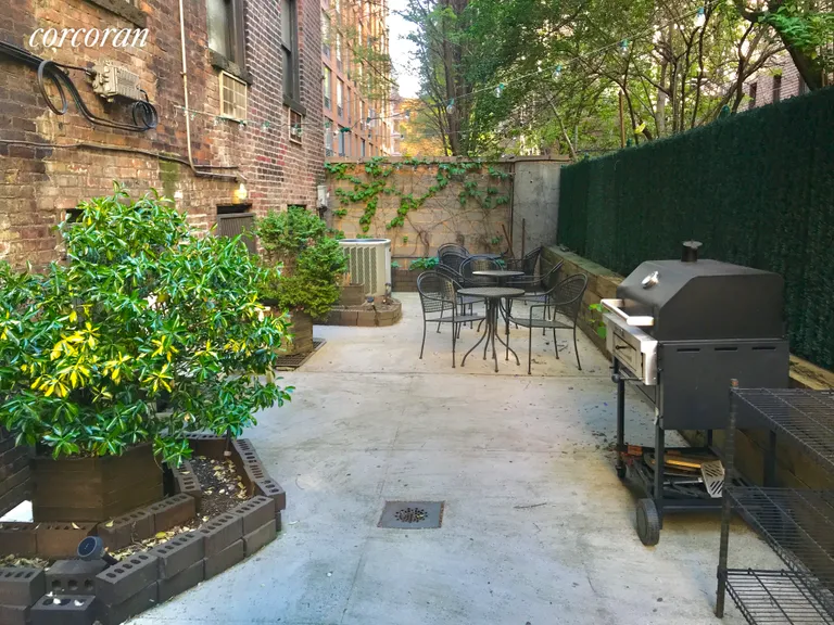 New York City Real Estate | View 317 West 54th Street, 2A | Shared Garden with Grill & Seating | View 8