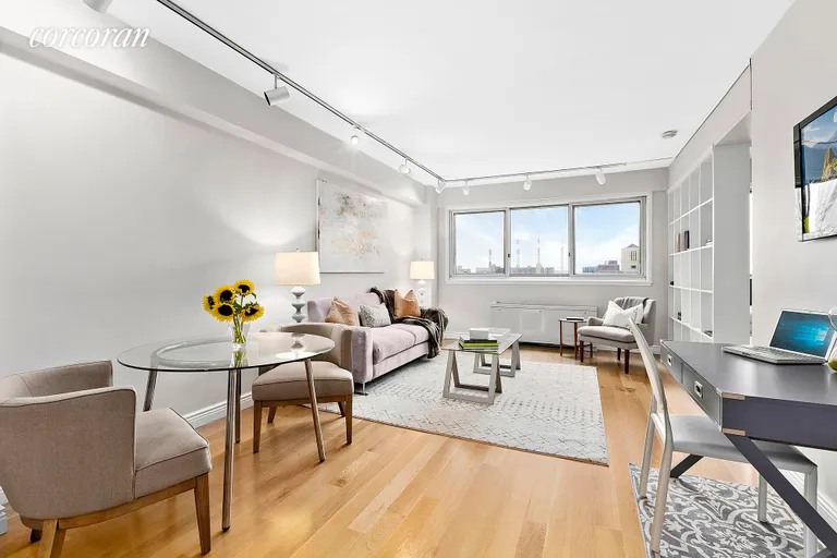 New York City Real Estate | View 401 East 65th Street, 14H | A wall of windows brings in light all day long | View 3