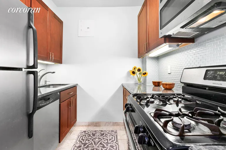 New York City Real Estate | View 401 East 65th Street, 14H | The galley kitchen is well appointed | View 4