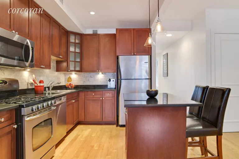 New York City Real Estate | View 305 3rd Street, 2H | Updated kitchen w/ island & marble tile backsplash | View 3