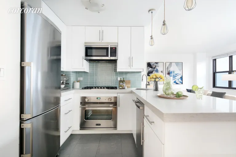 New York City Real Estate | View 115 East 9th Street, 5R | Beautifully renovated kitchen with long island | View 2