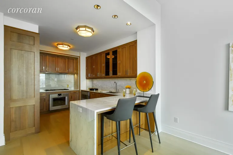 New York City Real Estate | View 30 Park Place, 64B | CASCADING MARBLE BREAKFAST BAR | View 3