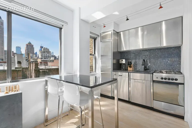 New York City Real Estate | View 310 West 56th Street, 8J | Open Stainless Steel Kitchen | View 2