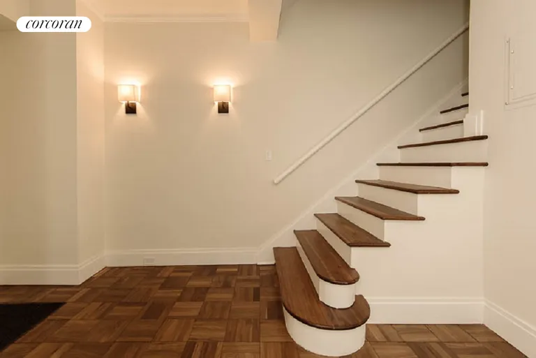 New York City Real Estate | View 25 Central Park West, 10P | Foyer and Elegant Staircase | View 3