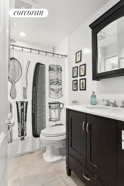New York City Real Estate | View 99 State Street, 1E | White tile shower/bath with large vanity | View 6