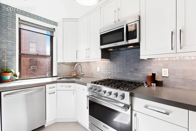 New York City Real Estate | View 30 East 9th Street, 3K | Windowed Kitchen with Viking and Bosch appliances! | View 2