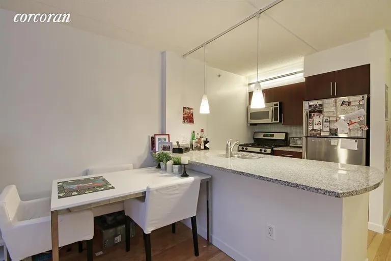 New York City Real Estate | View 555 West 23rd Street, N5R | Dining area and breakfast bar | View 2