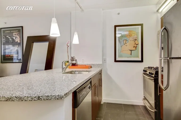 New York City Real Estate | View 555 West 23rd Street, N5R | Large open kitchen w/ dishwasher | View 4